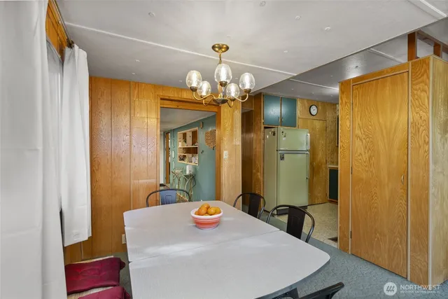 a view of washer and dryer with kitchen in the background