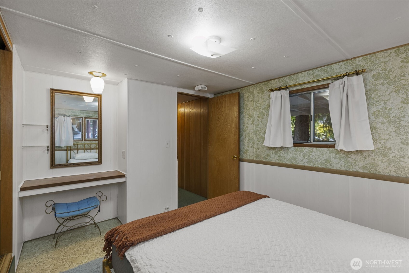 8491 Illahee Road Northeast Bremerton, WA 98311 - Photo 29 of 36 a bedroom with a bed and a window