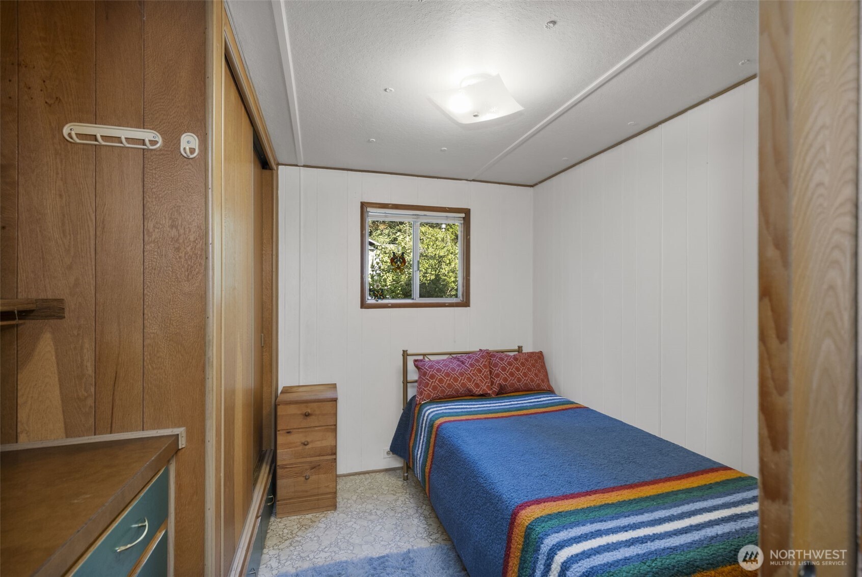 8491 Illahee Road Northeast Bremerton, WA 98311 - Photo 30 of 36 a bedroom with furniture and a window