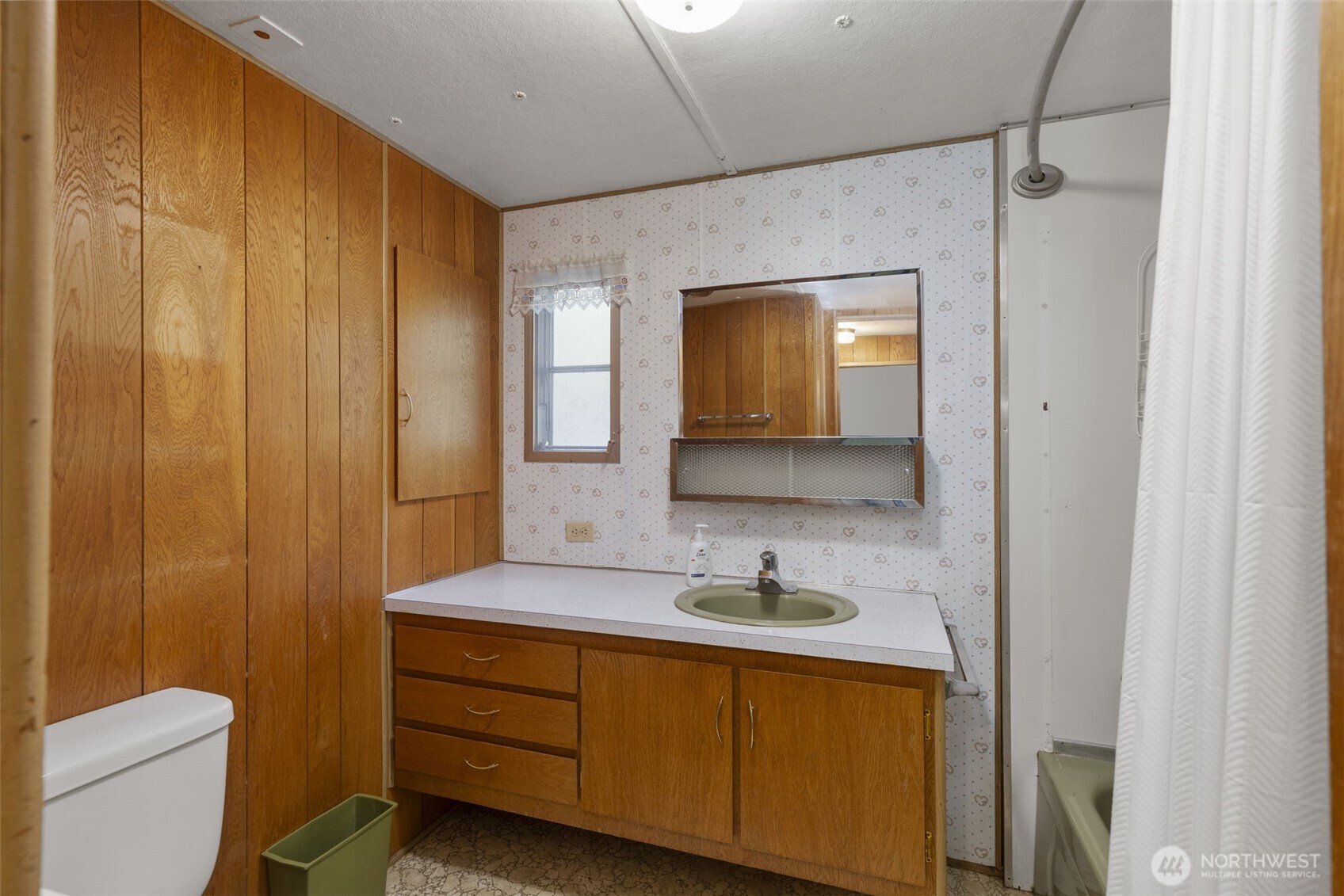 8491 Illahee Road Northeast Bremerton, WA 98311 - Photo 31 of 36 a bathroom with a sink a toilet and shower