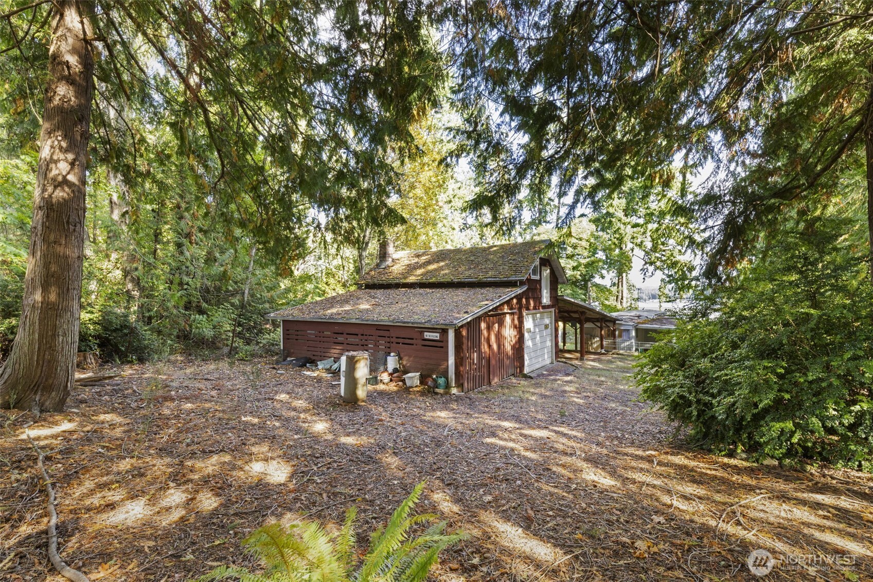 8491 Illahee Road Northeast Bremerton, WA 98311 - Photo 34 of 36 a view of a house with backyard and sitting area