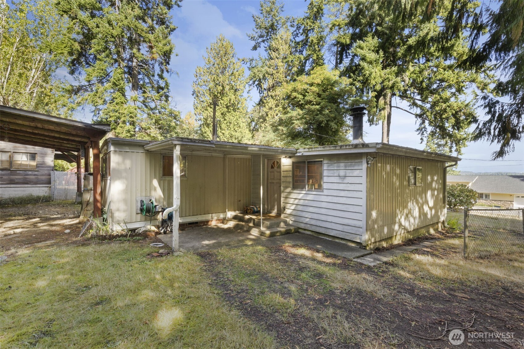 8491 Illahee Road Northeast Bremerton, WA 98311 - Photo 4 of 36 a view of a house with a yard