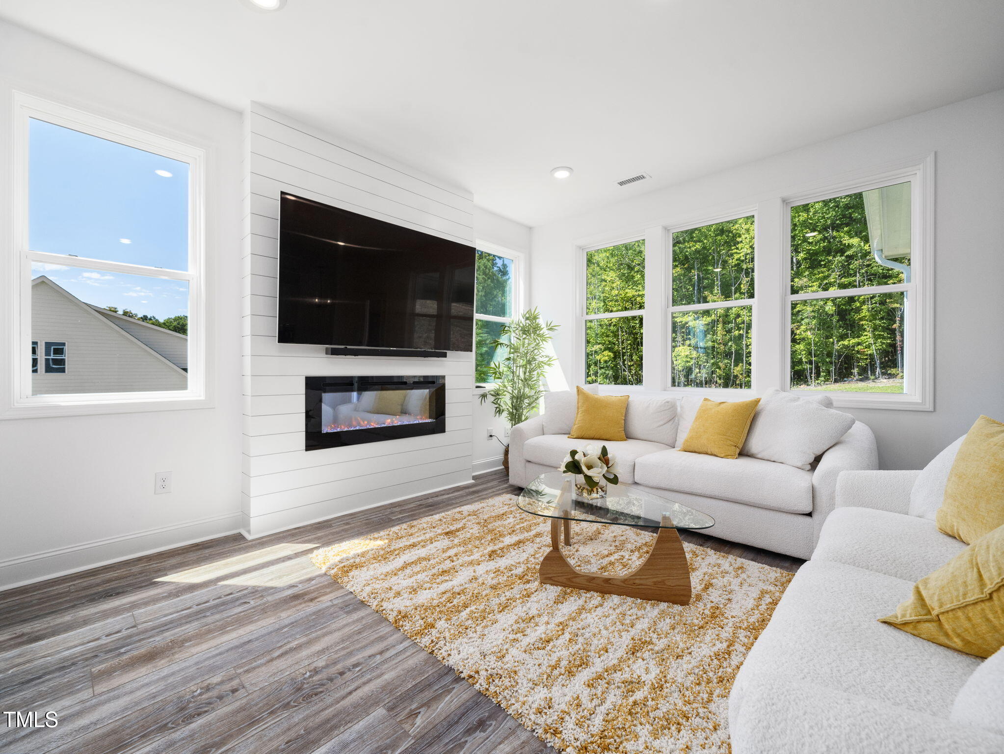 1112 Prominence Drive Durham, NC 27712 - Photo 12 of 40 a living room with furniture and a flat screen tv