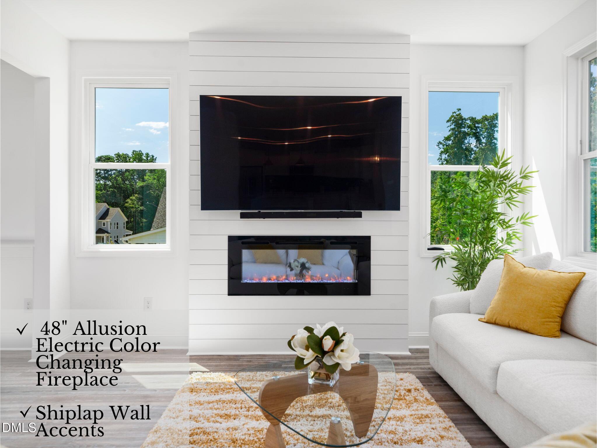 1112 Prominence Drive Durham, NC 27712 - Photo 13 of 40 a living room with furniture and a fireplace