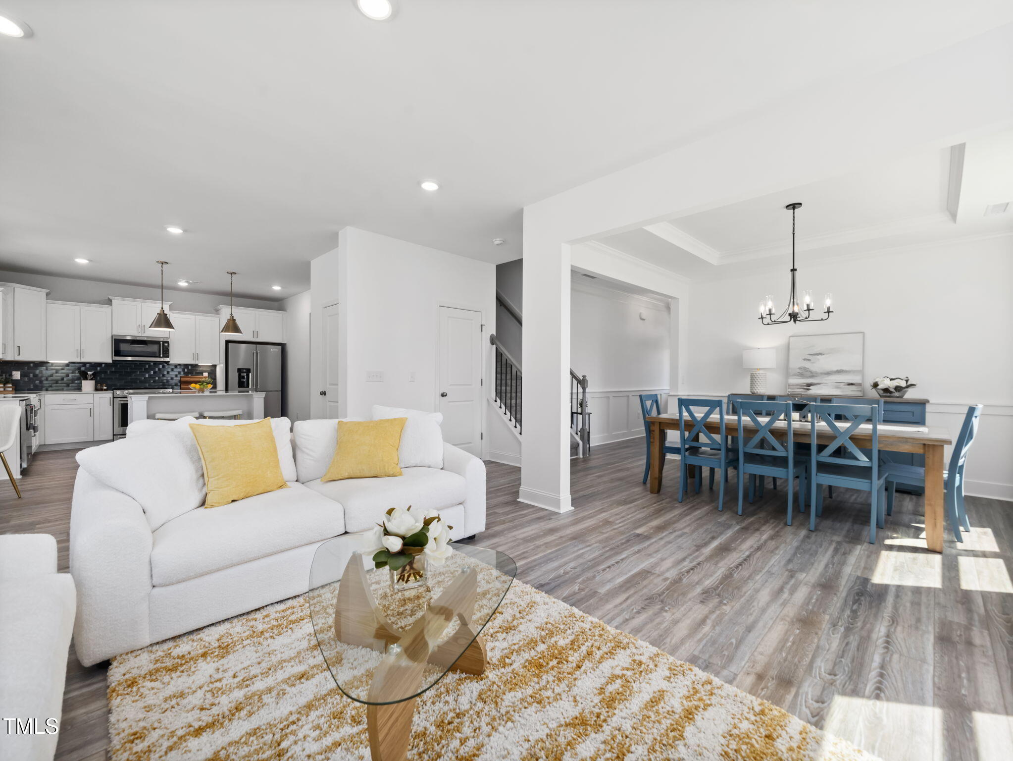 1112 Prominence Drive Durham, NC 27712 - Photo 14 of 40 a living room with furniture and kitchen view with wooden floor