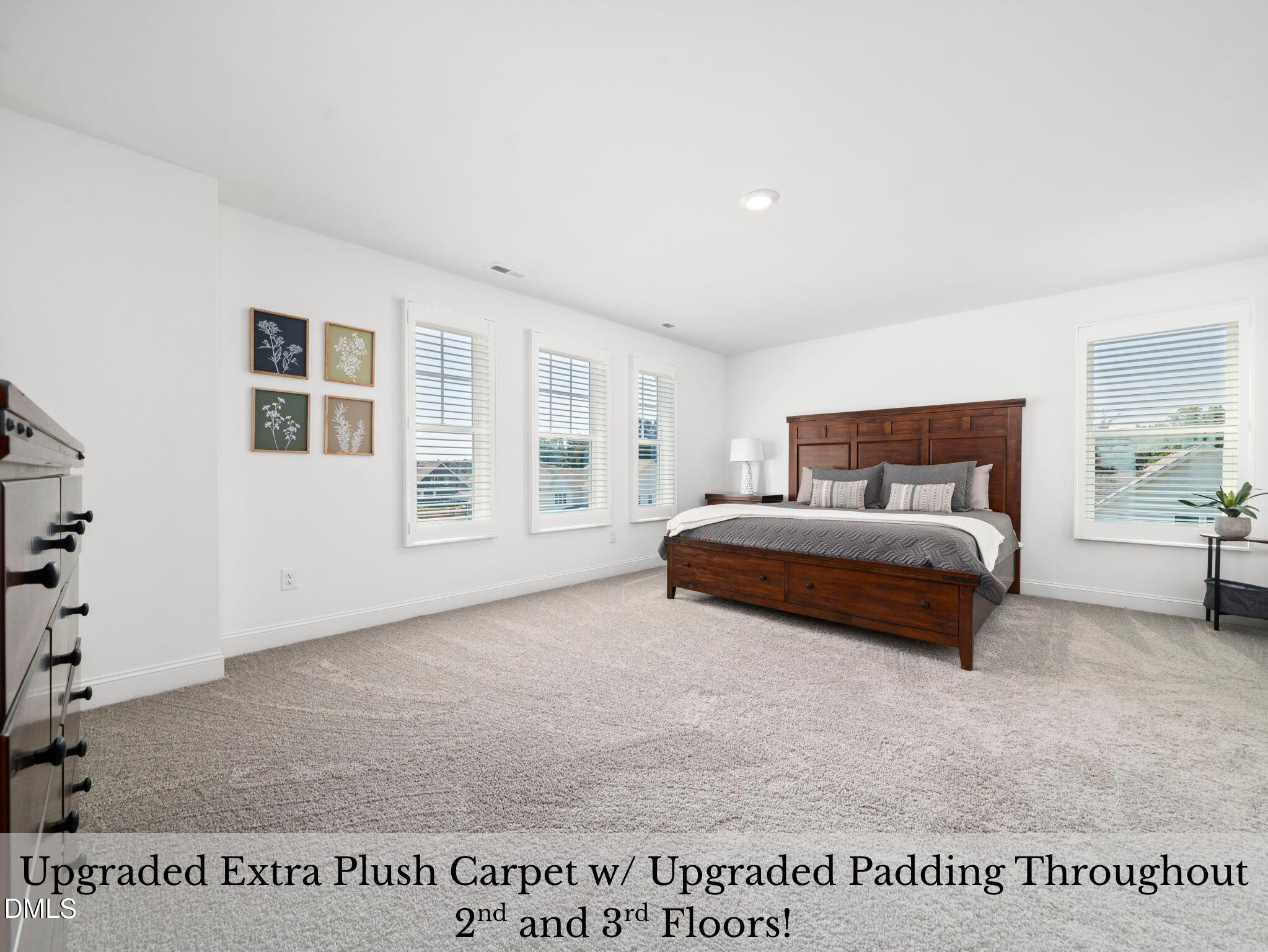 1112 Prominence Drive Durham, NC 27712 - Photo 16 of 40 a bedroom with a bed and a window