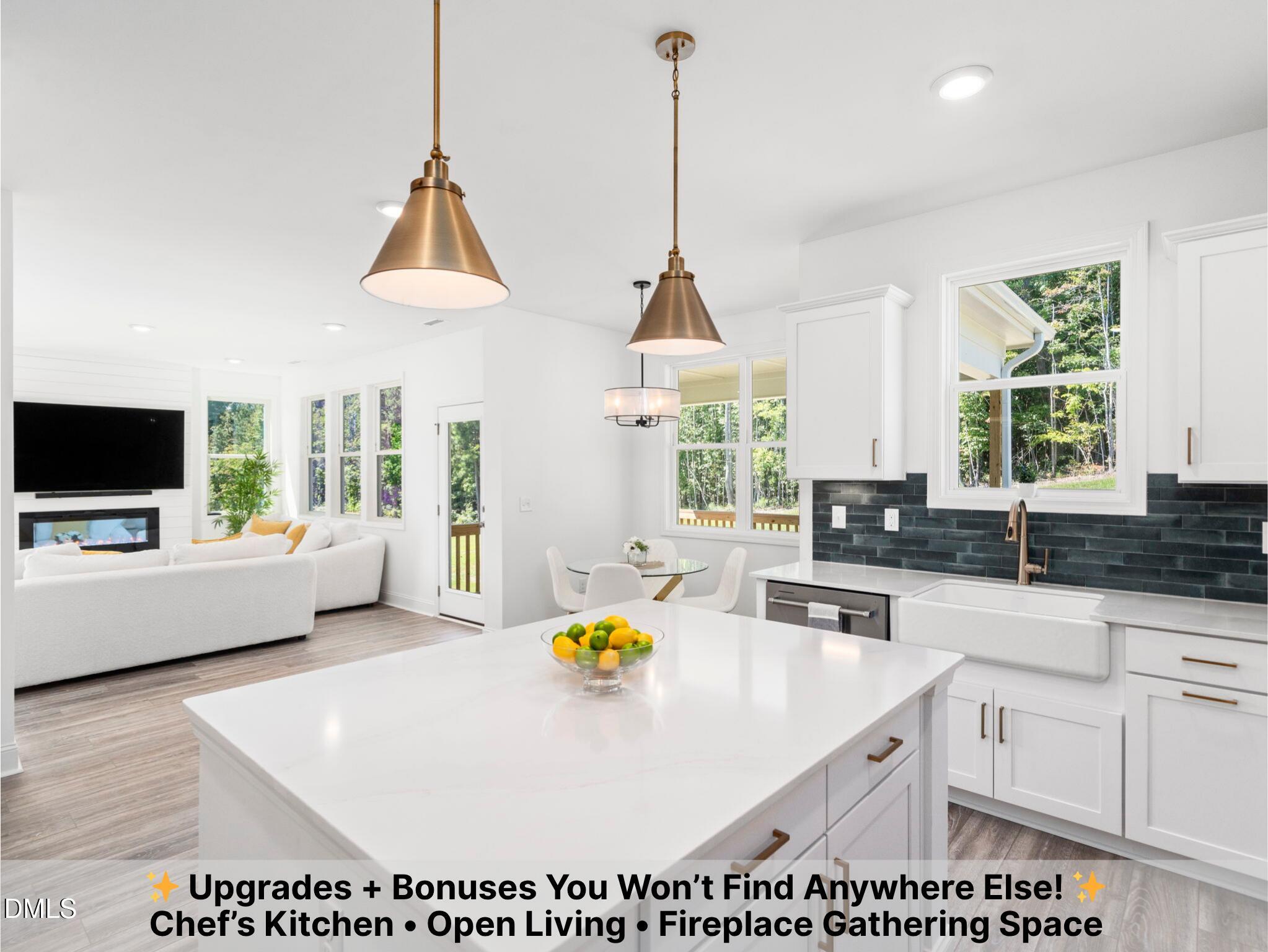 1112 Prominence Drive Durham, NC 27712 - Photo 2 of 40 a kitchen with kitchen island granite countertop a stove a sink a dining table and chairs