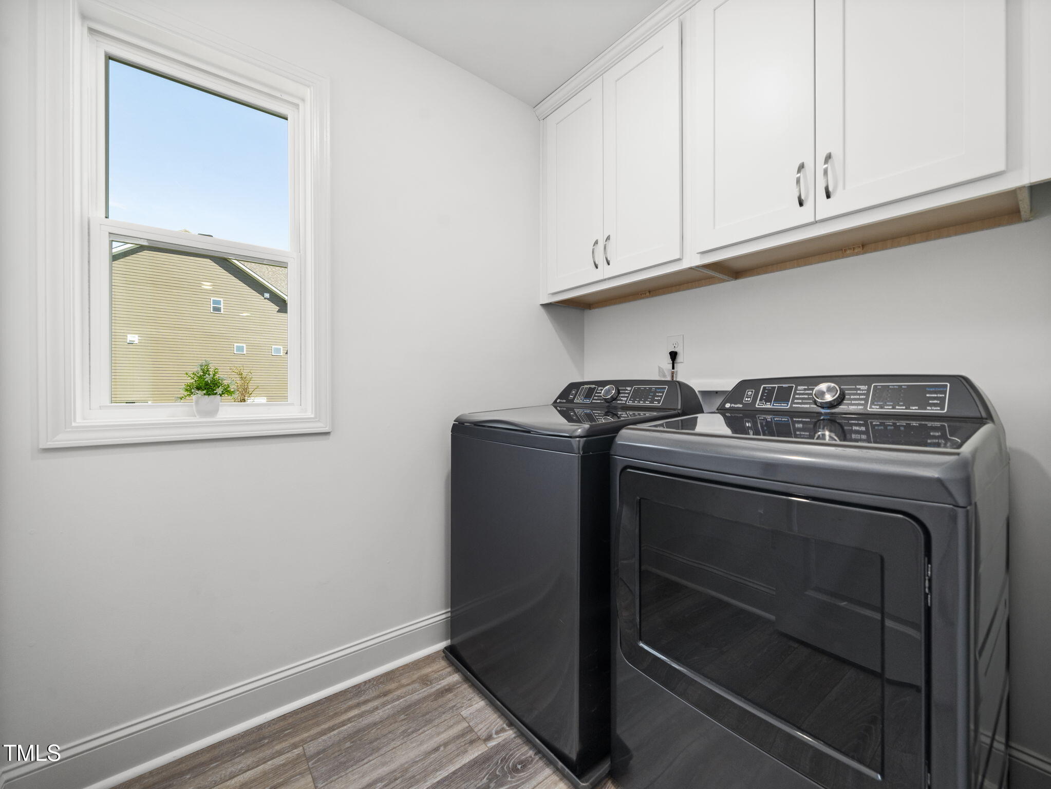 1112 Prominence Drive Durham, NC 27712 - Photo 25 of 40 a utility room with dryer and washer