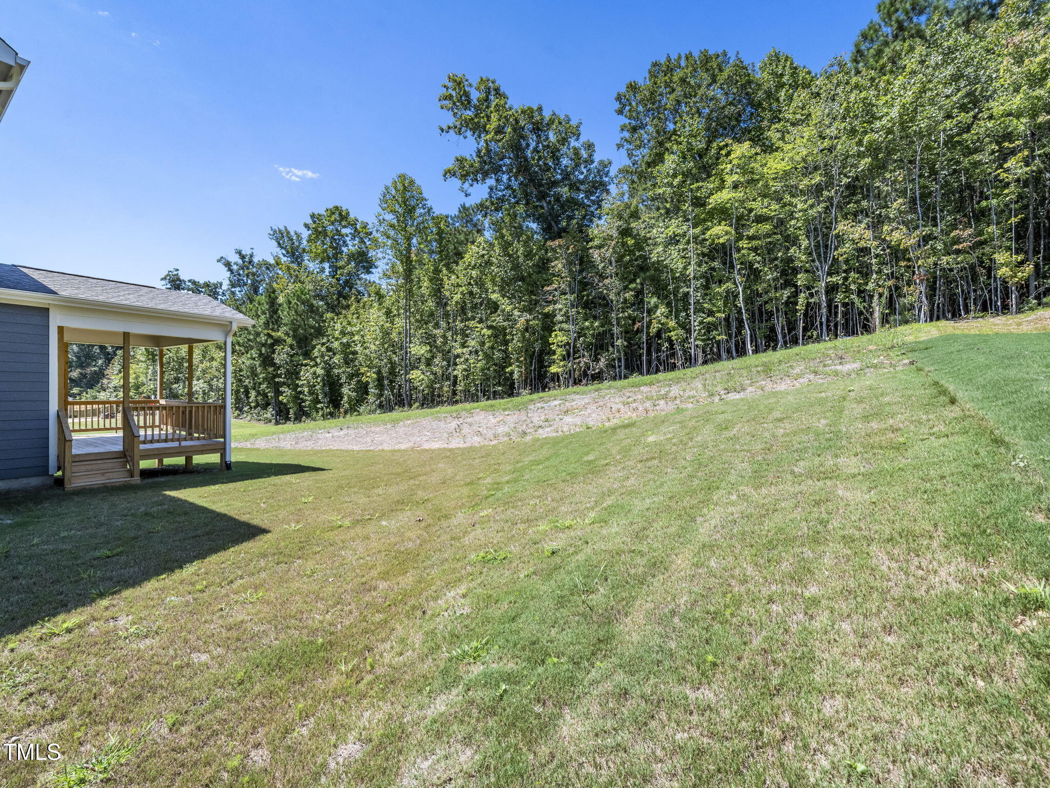 1112 Prominence Drive Durham, NC 27712 - Photo 33 of 40 a view of a yard with a house in the background