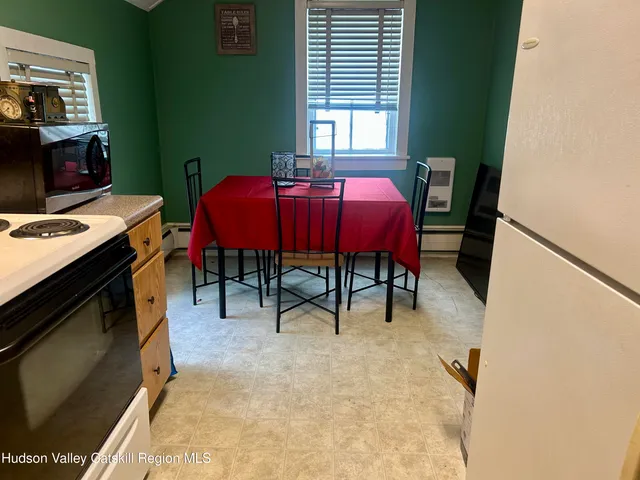 a view of a livingroom with furniture and a window
