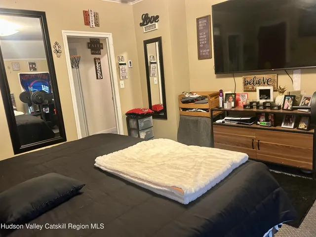 a kitchen with stainless steel appliances kitchen island granite countertop a sink stove and refrigerator