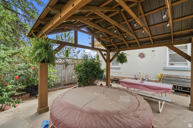 5264 West 5500th Street South Hooper, UT 84315 - Photo 28 of 38 Outdoor covered patio with a wood-frame gazebo and corrugated metal roof