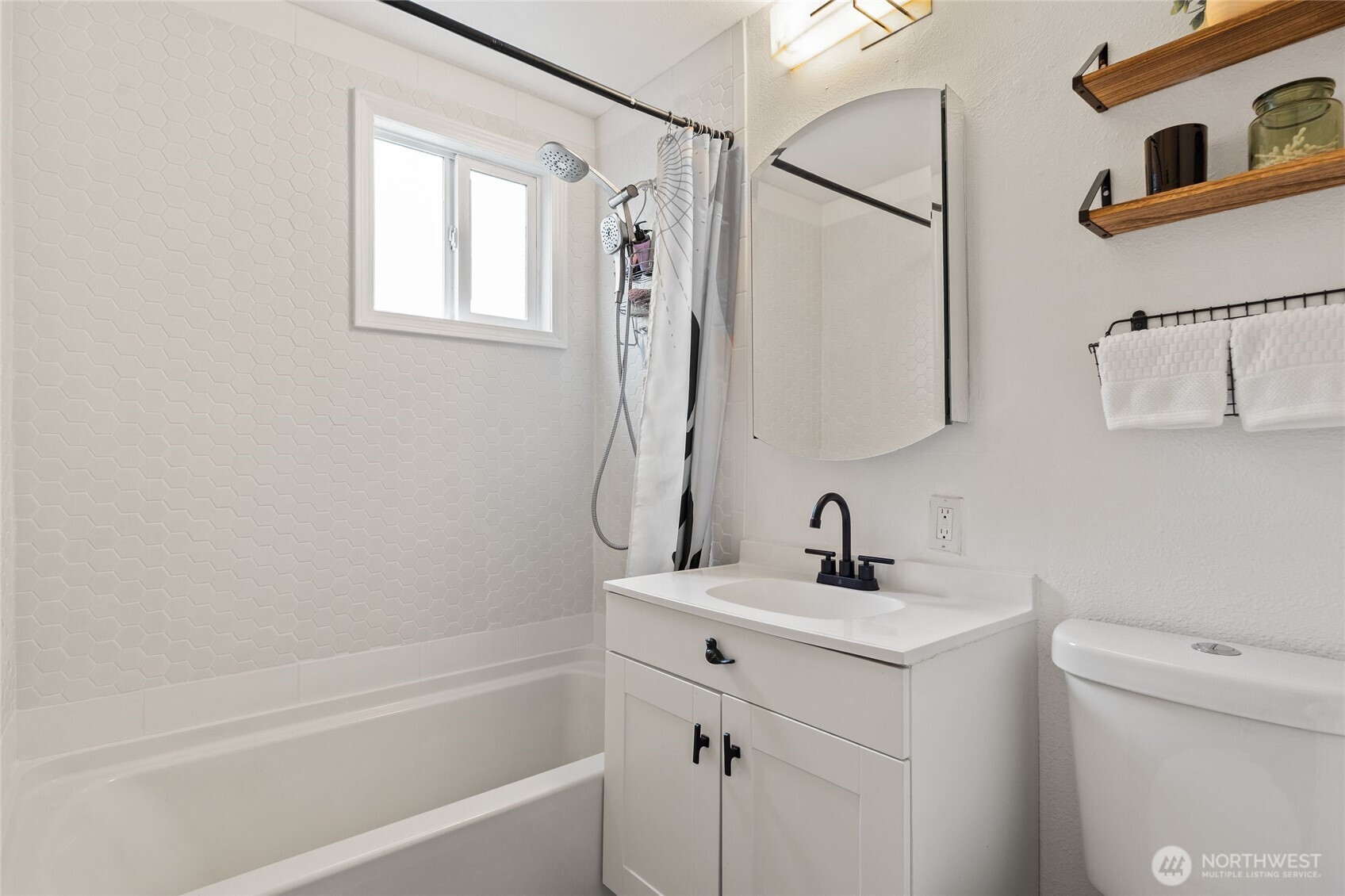 11 R Street Southeast Auburn, WA 98002 - Photo 18 of 38 a bathroom with a sink a toilet and shower