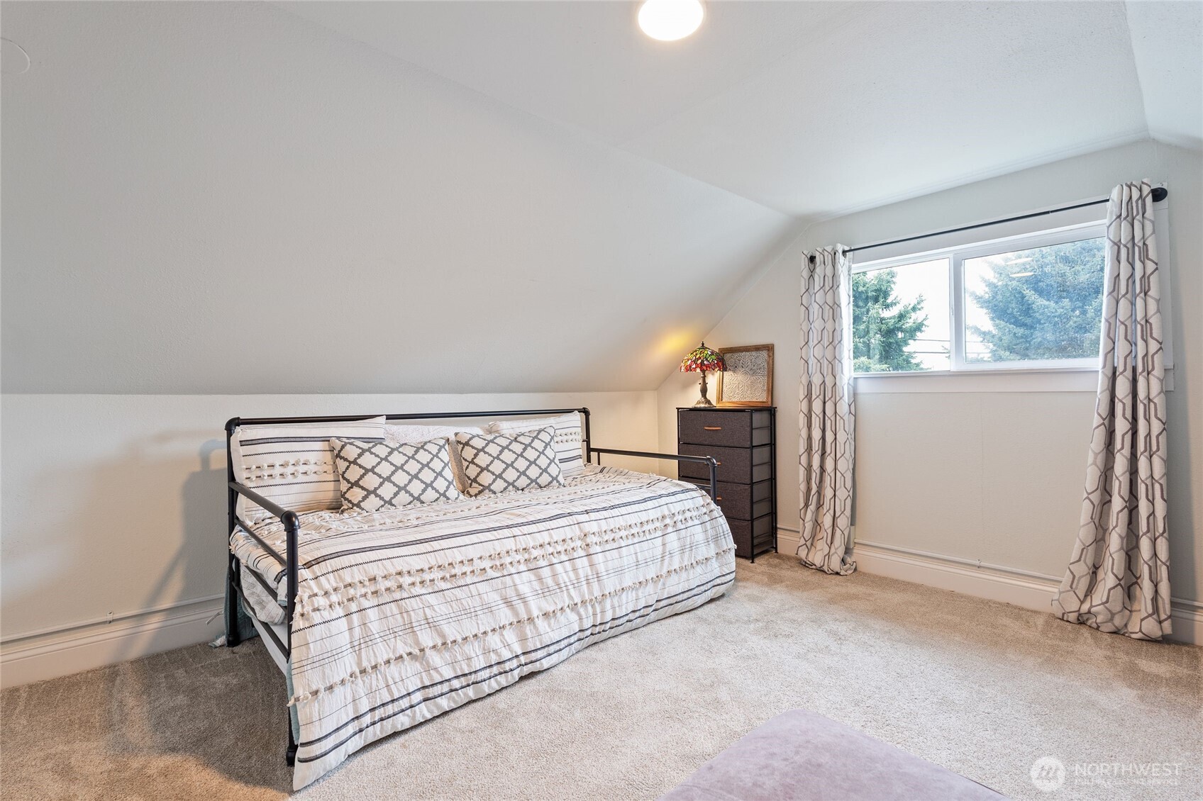 11 R Street Southeast Auburn, WA 98002 - Photo 24 of 38 a bedroom with a bed table and a window