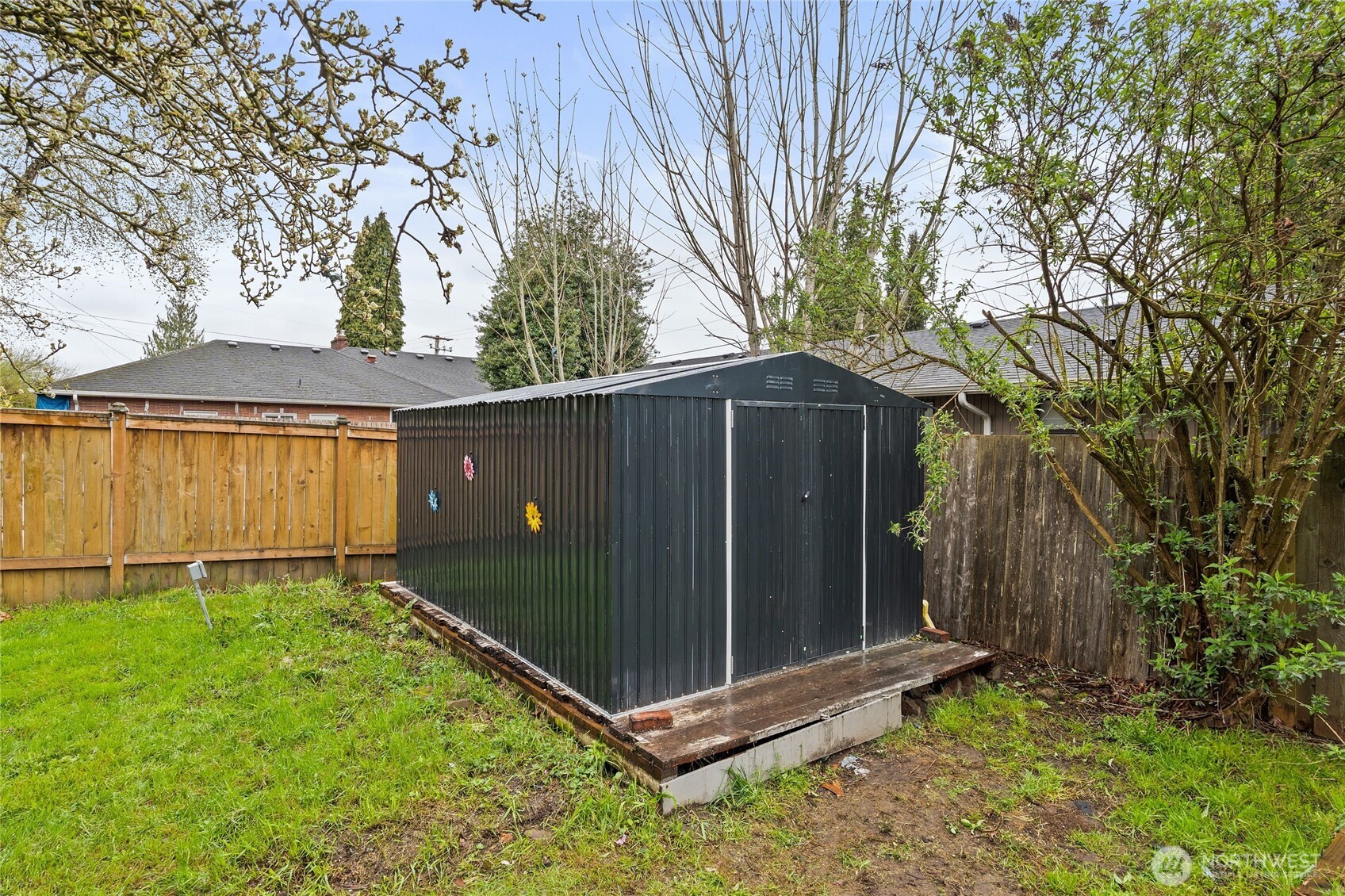11 R Street Southeast Auburn, WA 98002 - Photo 37 of 38 a backyard of a house with a fence and trees