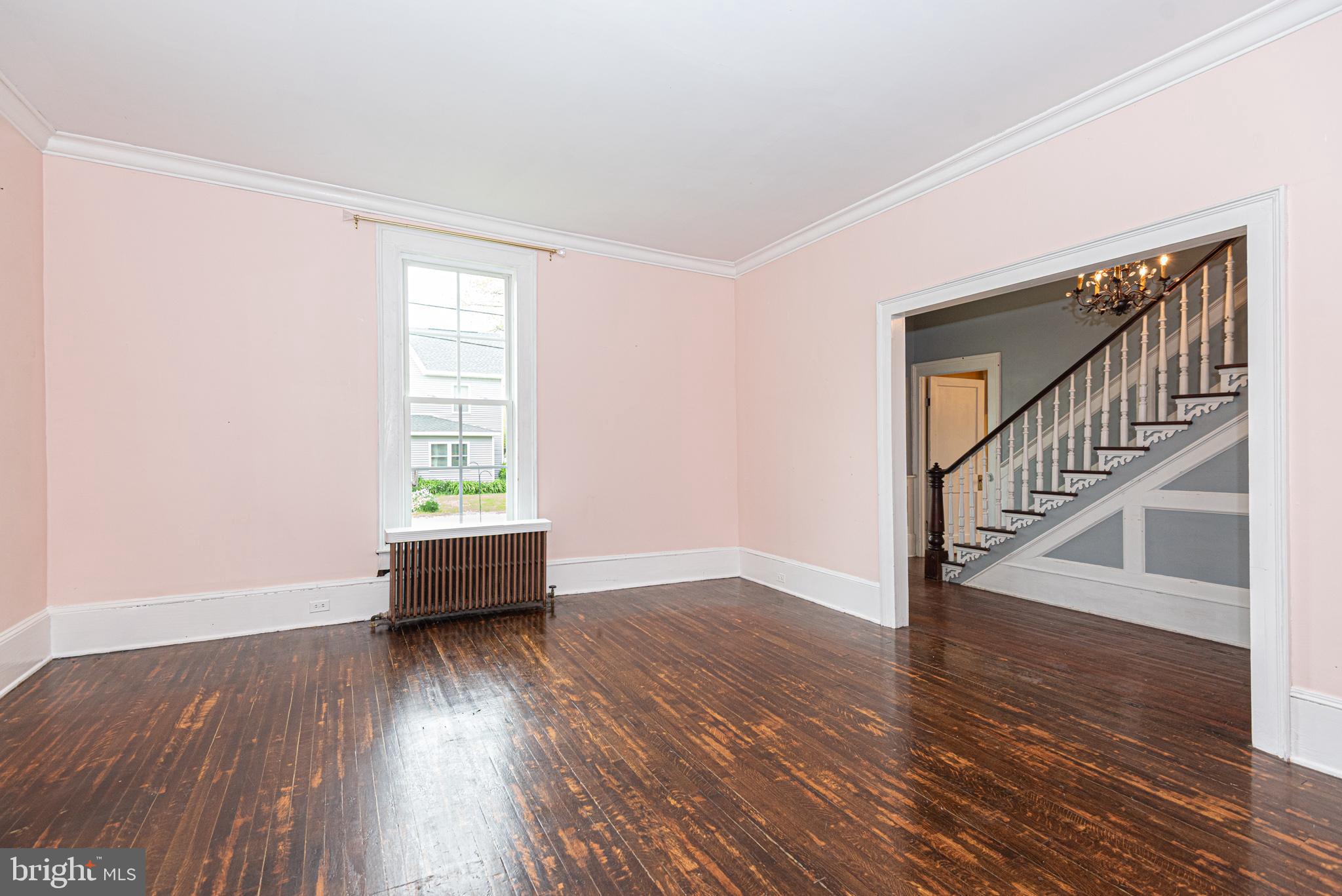 8318 Langmaid Road Newark, MD 21841 - Photo 39 of 122 a view of empty room with wooden floor and fan