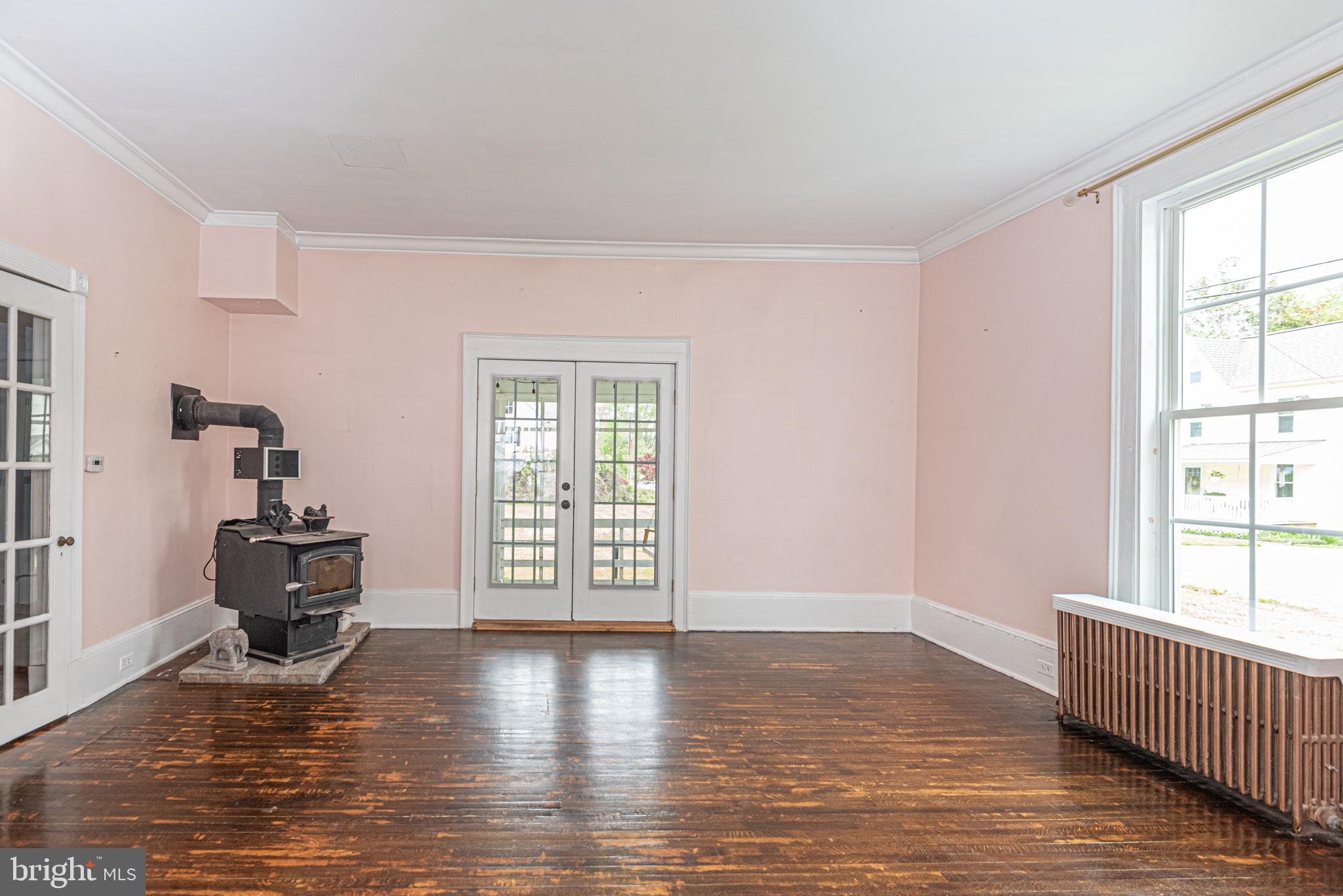 8318 Langmaid Road Newark, MD 21841 - Photo 40 of 122 wooden floor in an empty room with a window