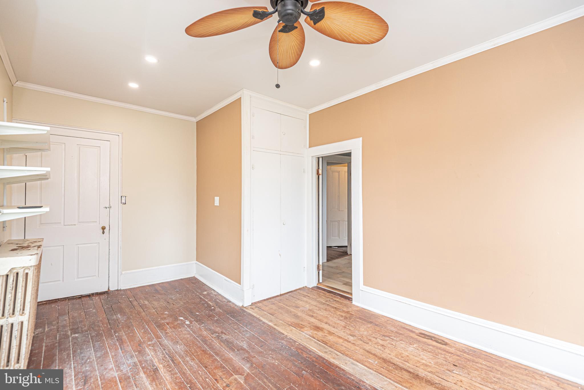 8318 Langmaid Road Newark, MD 21841 - Photo 51 of 122 a view of an empty room and wooden floor