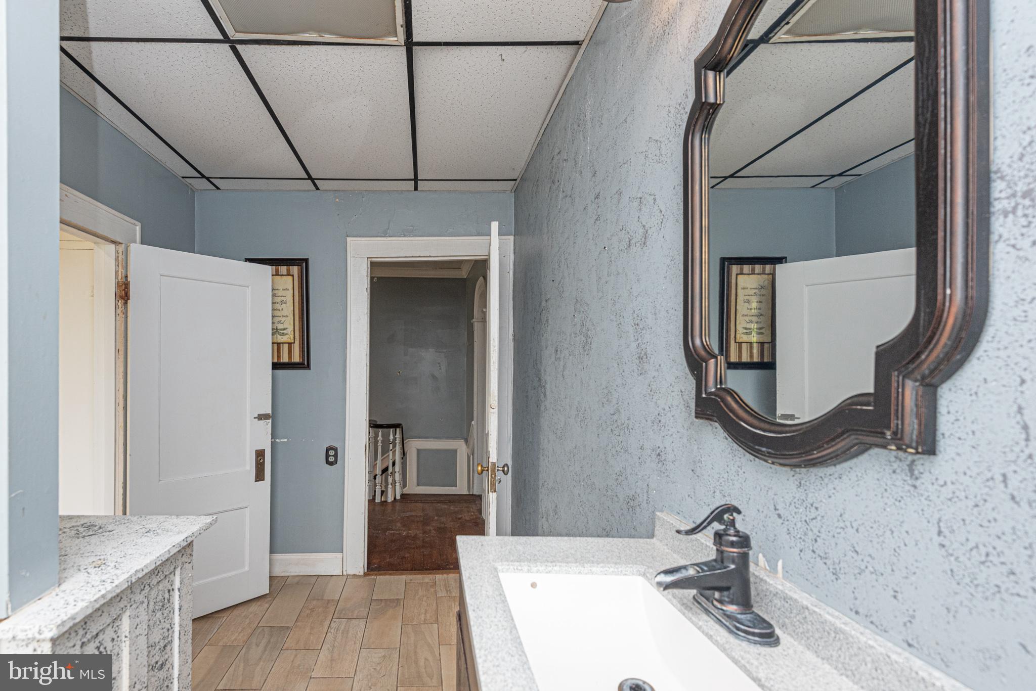 8318 Langmaid Road Newark, MD 21841 - Photo 55 of 122 a bathroom with a sink and a mirror