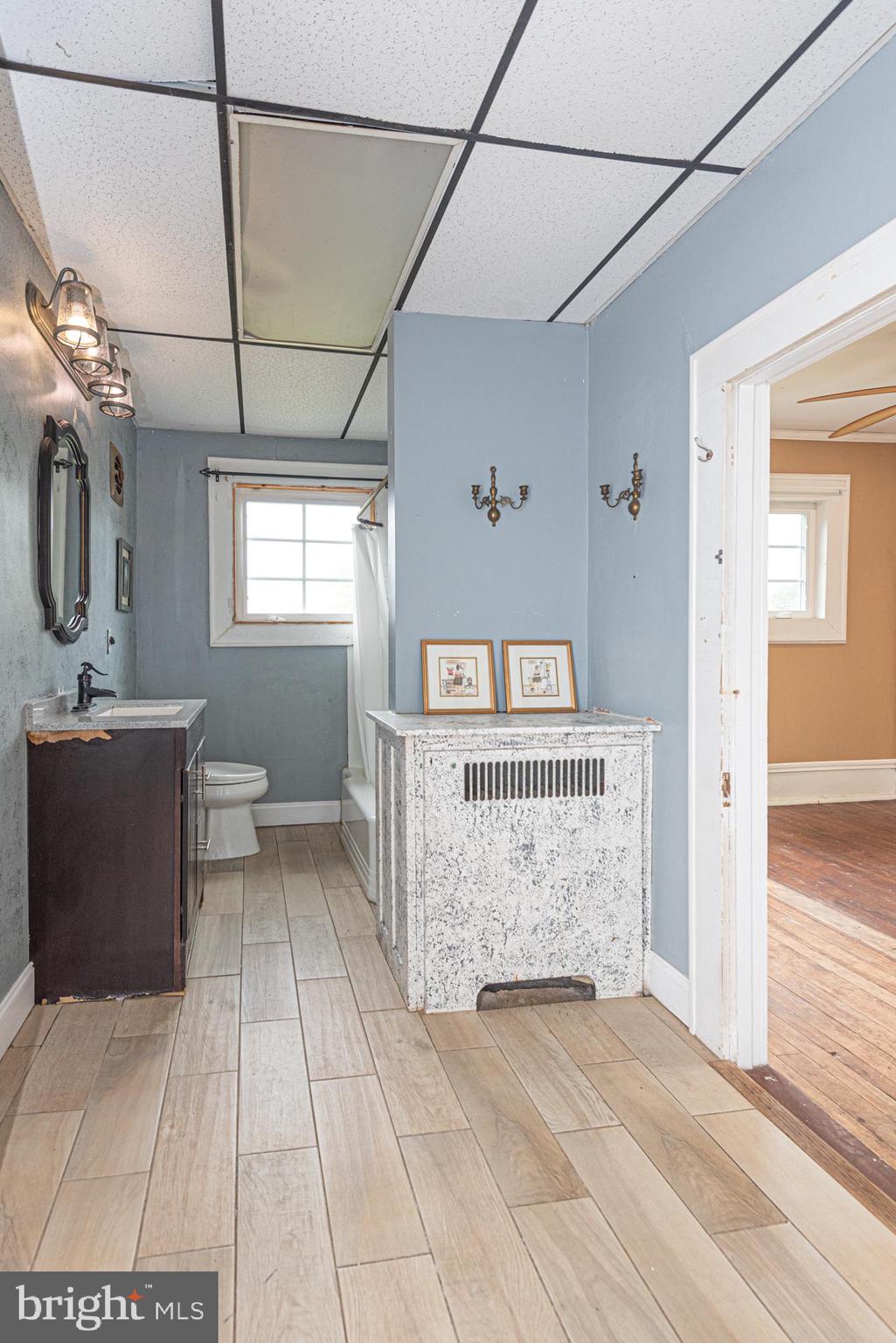 8318 Langmaid Road Newark, MD 21841 - Photo 57 of 122 a view of a bathroom with a sink and a bathtub