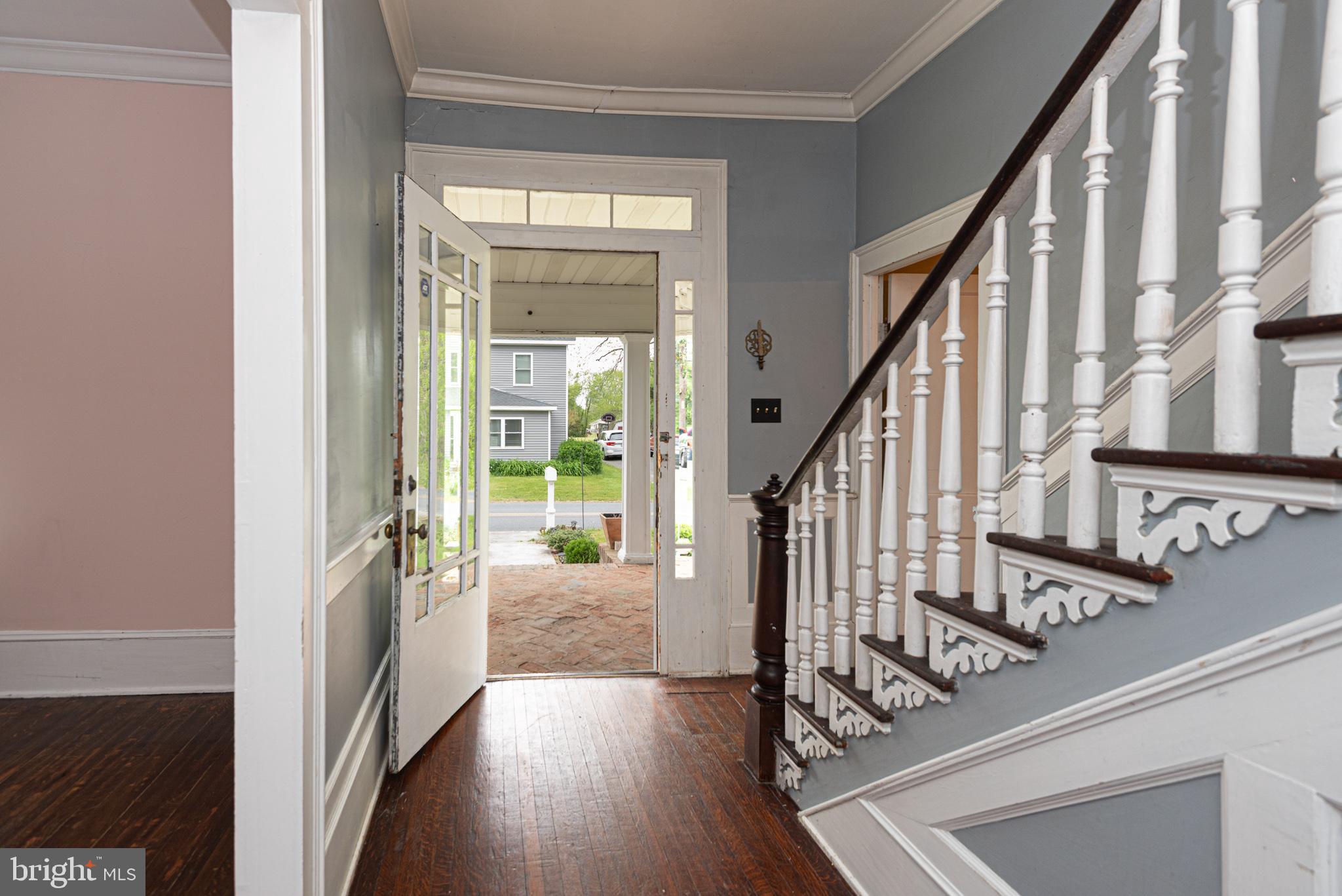 8318 Langmaid Road Newark, MD 21841 - Photo 6 of 122 a view of an entryway with wooden floor and door