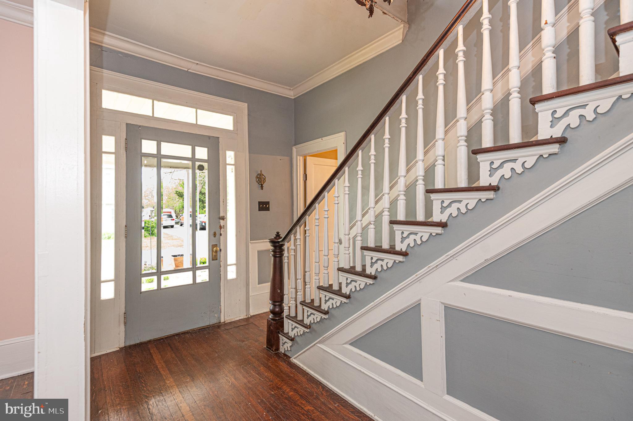 8318 Langmaid Road Newark, MD 21841 - Photo 7 of 122 a view of staircase with wooden floor and white walls