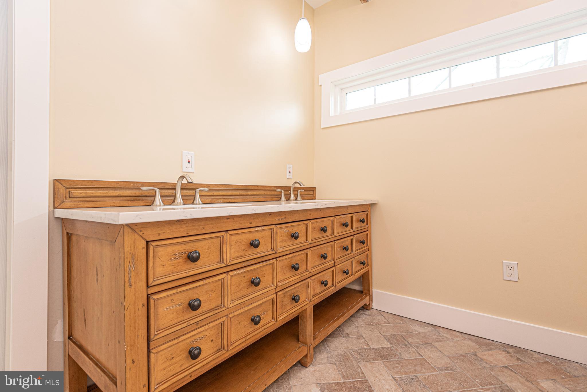 8318 Langmaid Road Newark, MD 21841 - Photo 76 of 122 a bathroom with a sink and a mirror