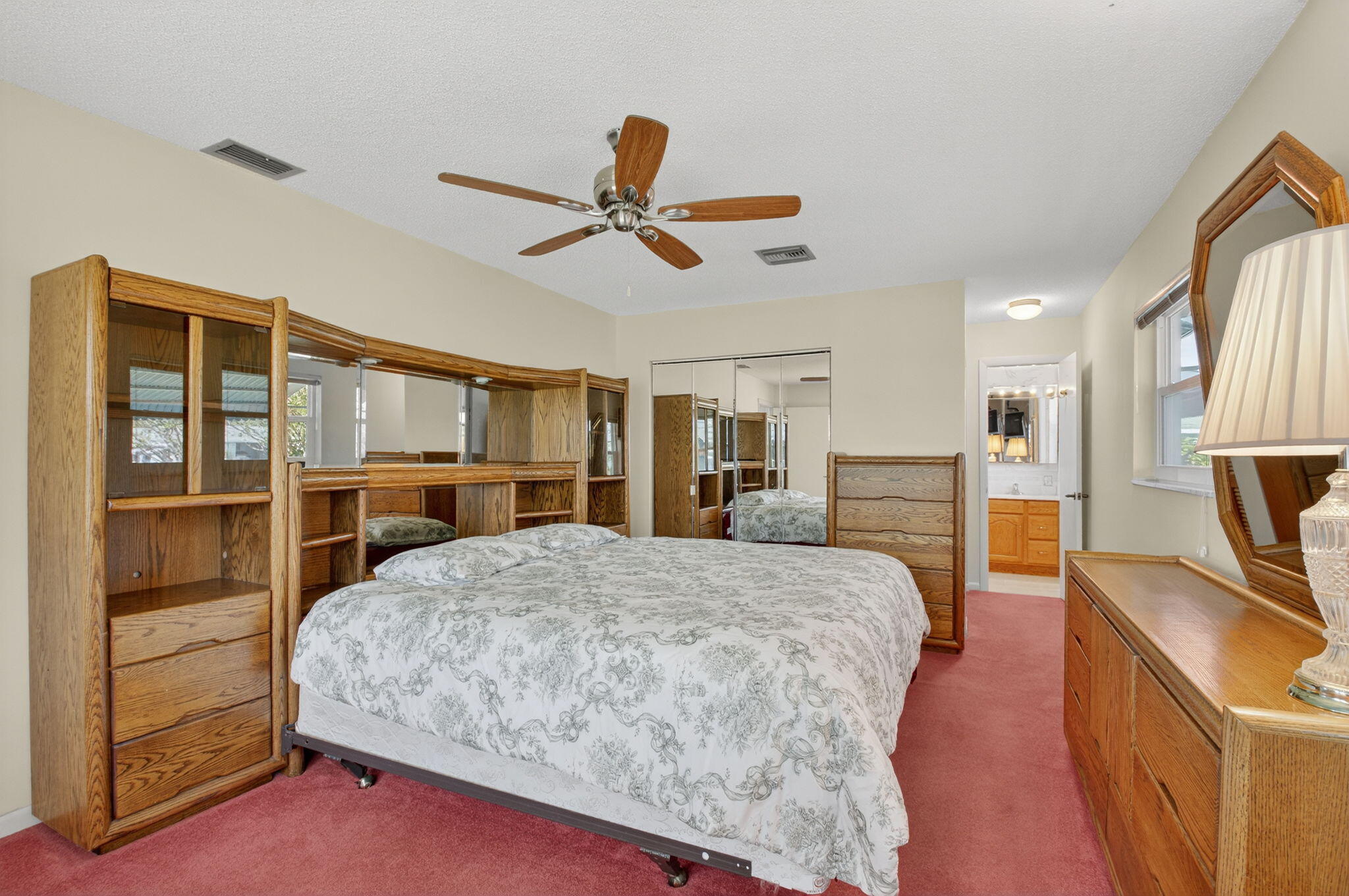634 Hummingbird Lane Delray Beach, FL 33445 - Photo 23 of 37 a living room with a bed furniture and a flat screen tv
