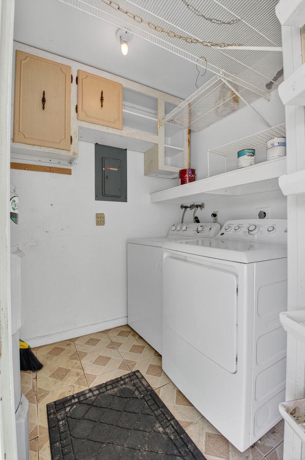 634 Hummingbird Lane Delray Beach, FL 33445 - Photo 25 of 37 a utility room with cabinets washer and dryer