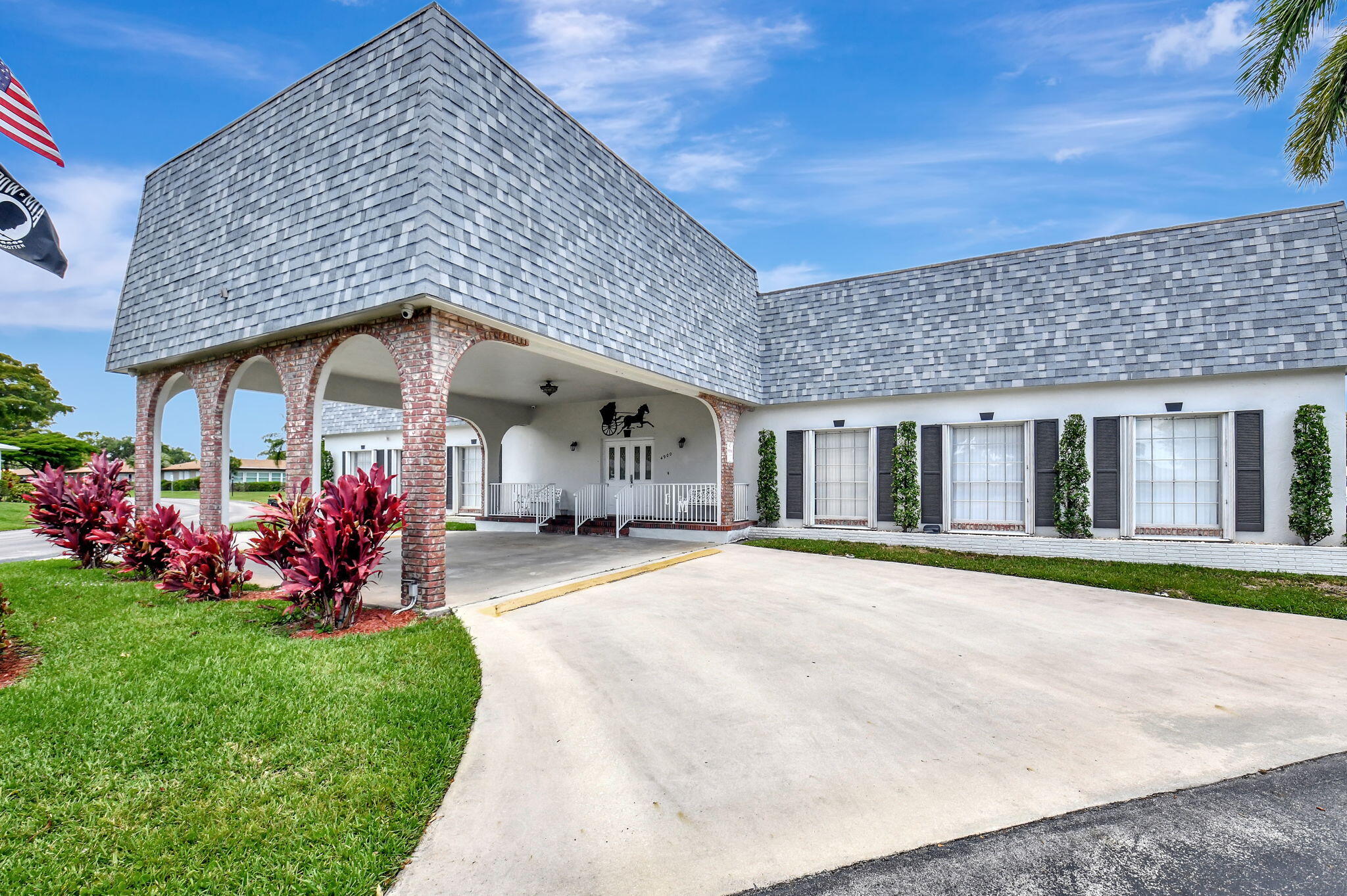 634 Hummingbird Lane Delray Beach, FL 33445 - Photo 30 of 37 a front view of a house with garden