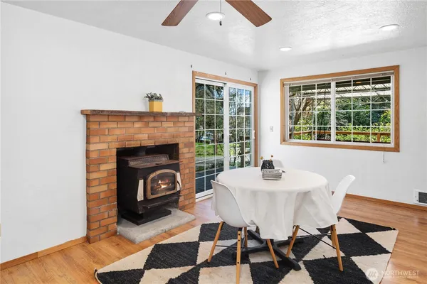a dining room with furniture and window