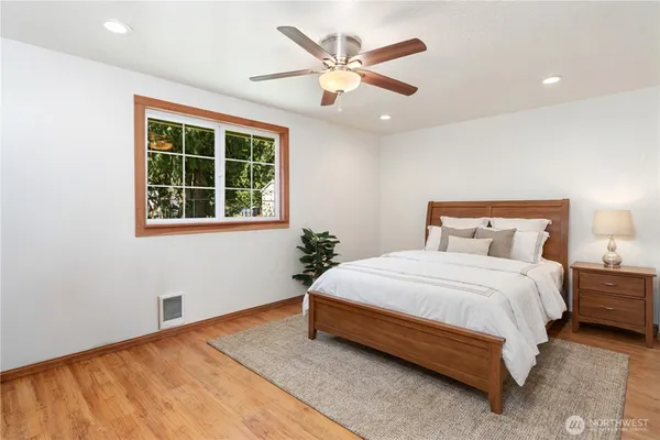 a bedroom with a bed and window