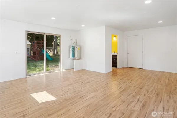 a bathroom with a sink mirror and toilet