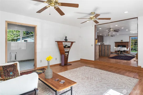 a view of a livingroom with furniture and a ceiling fan