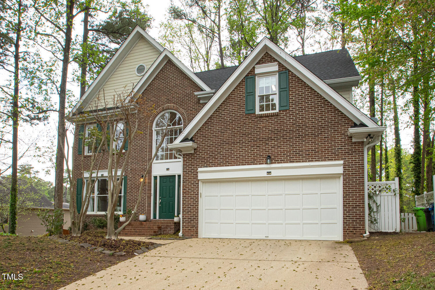 4604 Troone Court Raleigh, NC 27612 - Photo 54 of 54 a front view of a house with a yard and garage