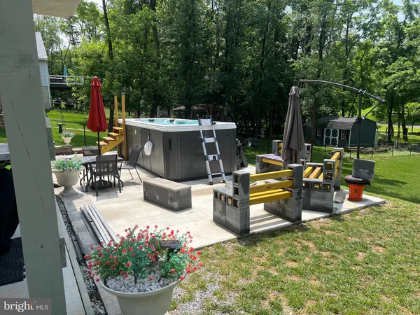 a view of a backyard with sitting area and furniture