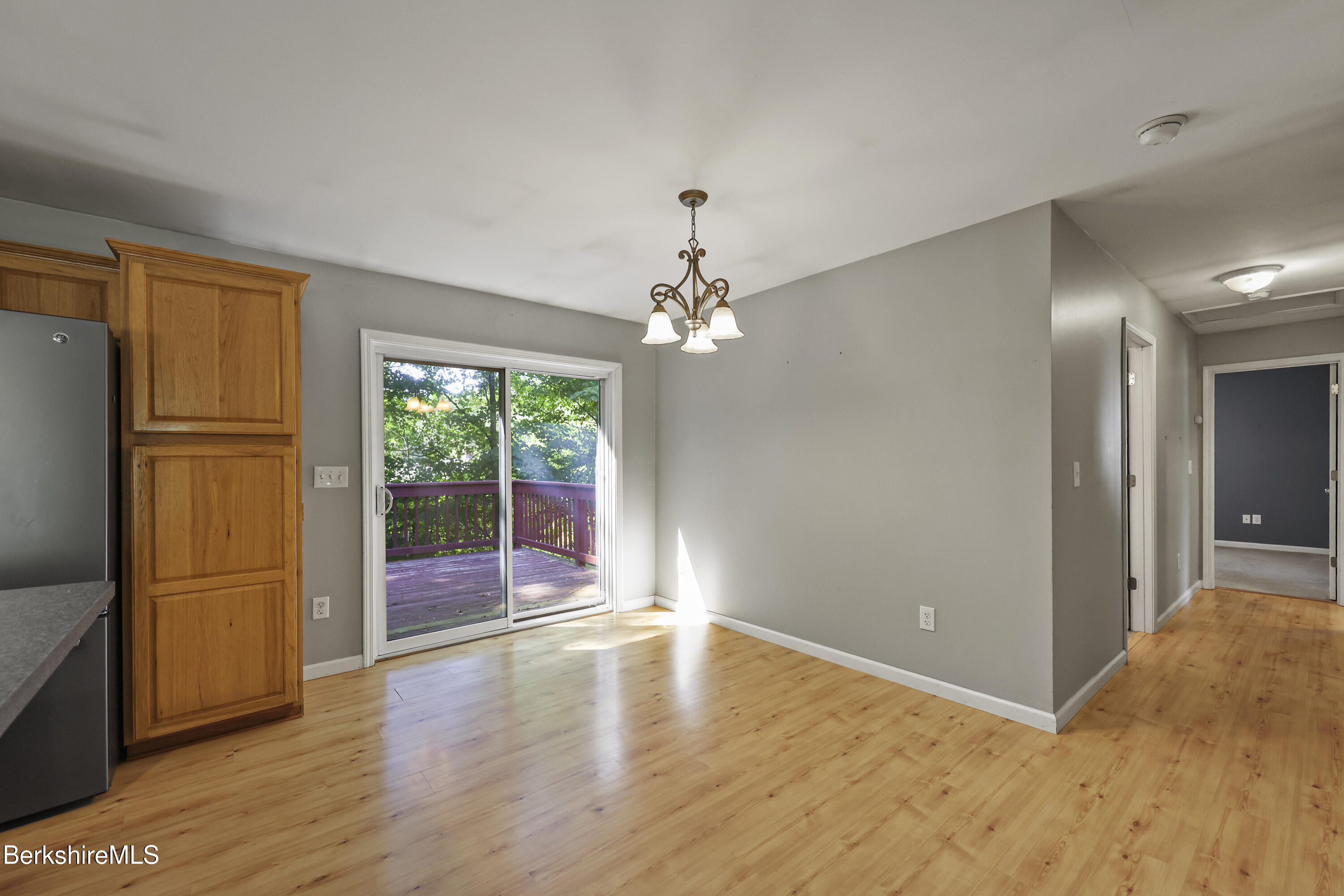 29 Balance Rock Road Lanesborough, MA 01237 - Photo 11 of 38 wooden floor in an empty room with a window