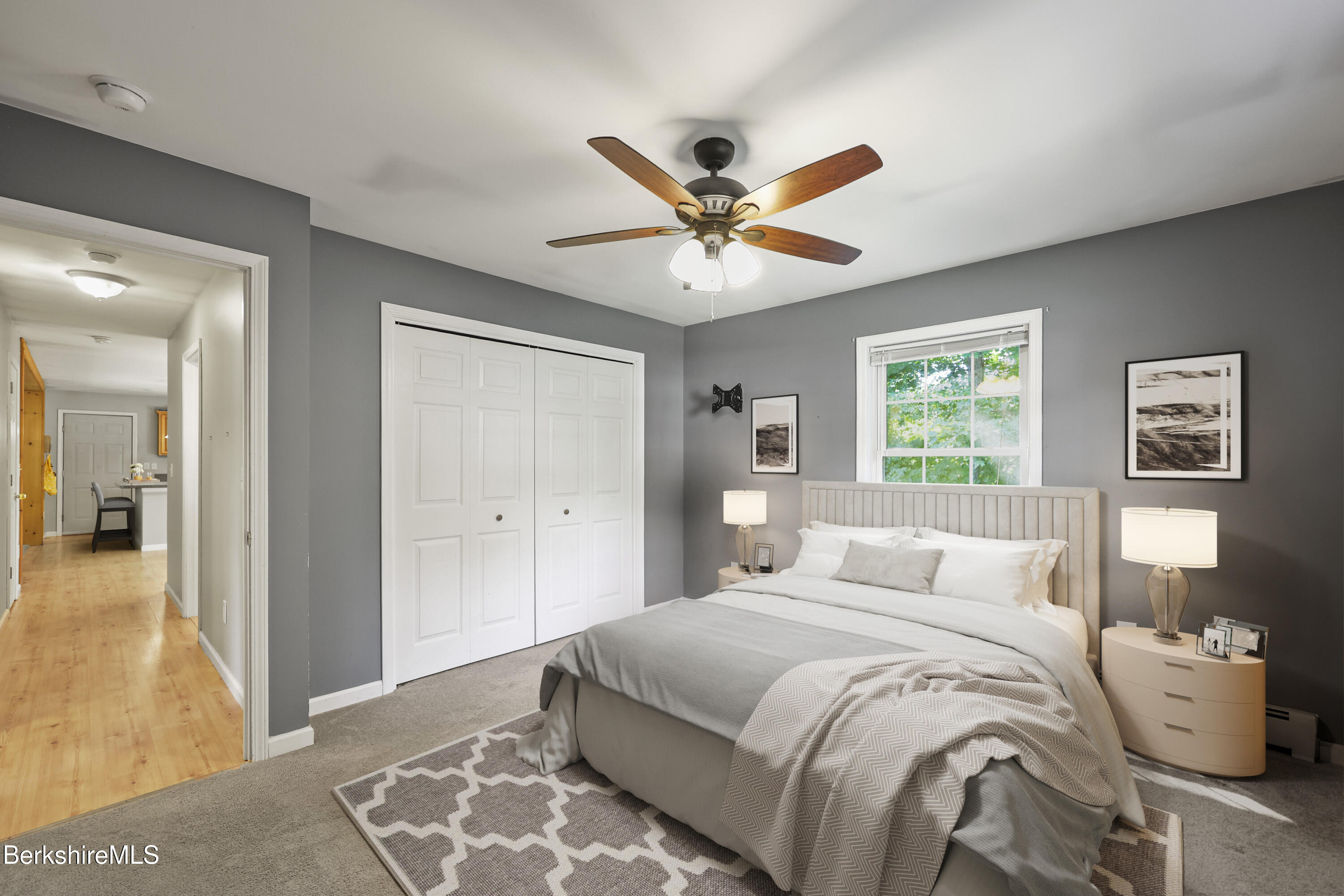 29 Balance Rock Road Lanesborough, MA 01237 - Photo 12 of 38 a bedroom with a large bed and a chandelier