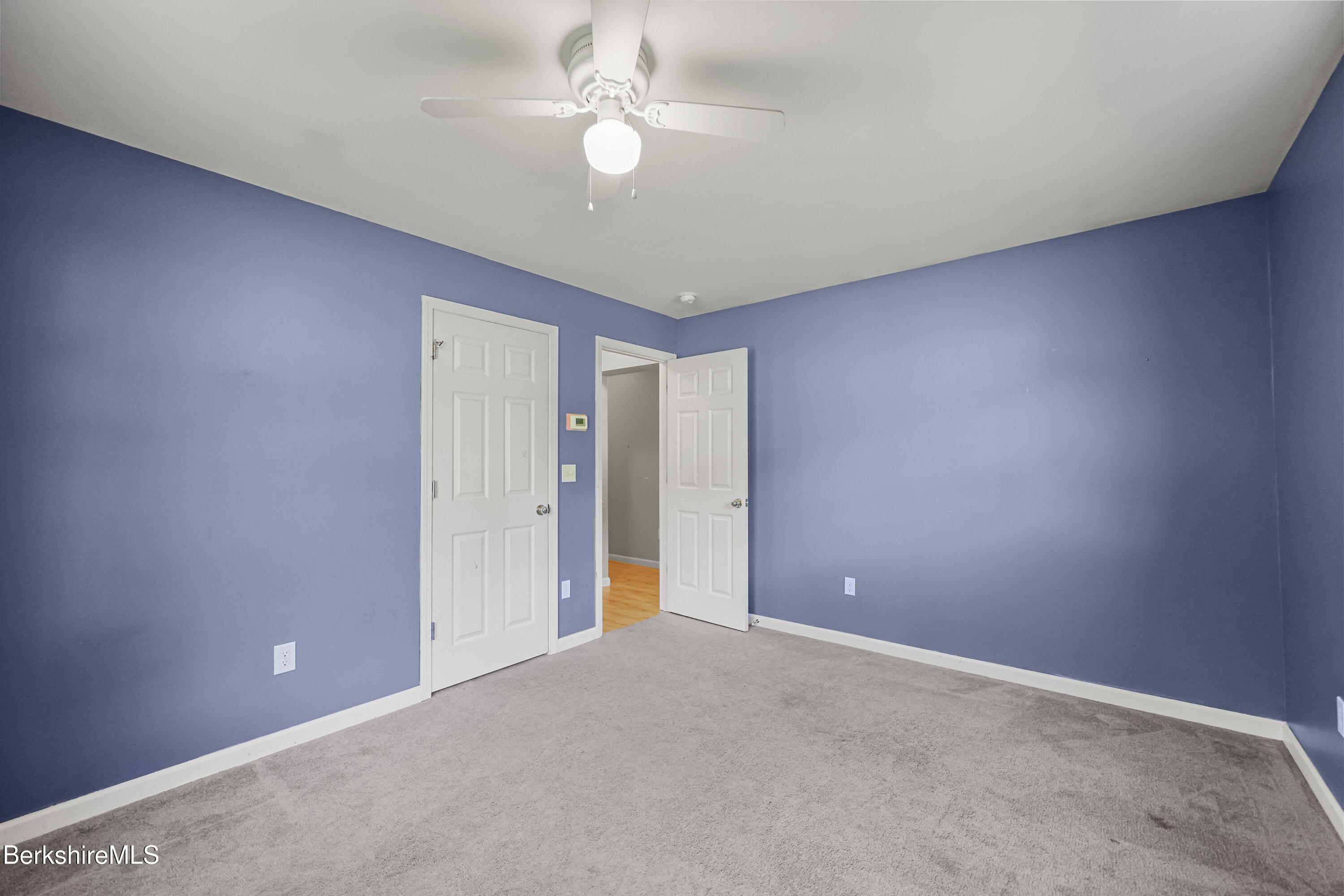 29 Balance Rock Road Lanesborough, MA 01237 - Photo 16 of 38 an empty room with a ceiling fan and a window