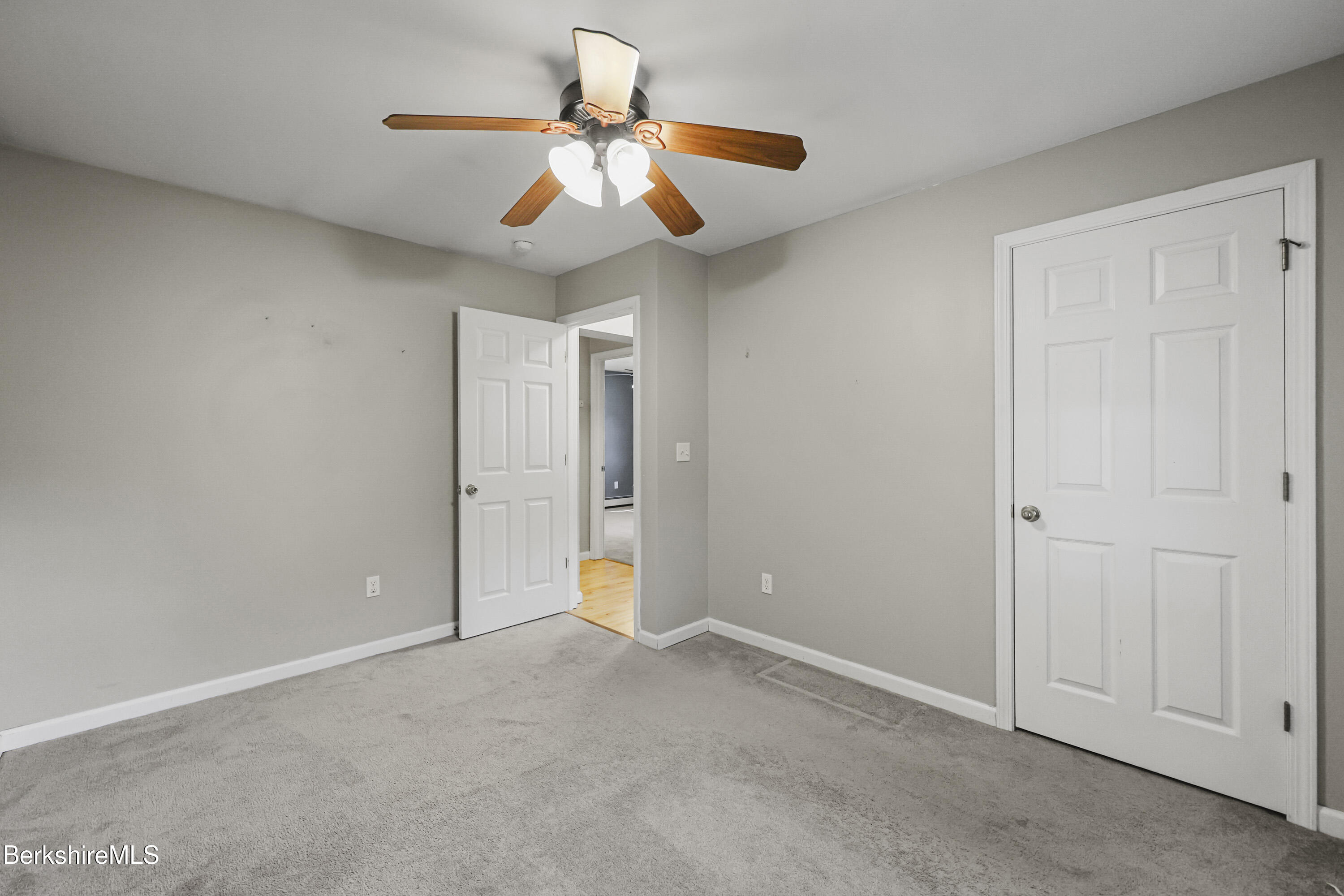 29 Balance Rock Road Lanesborough, MA 01237 - Photo 19 of 38 a view of an empty room and chandelier fan