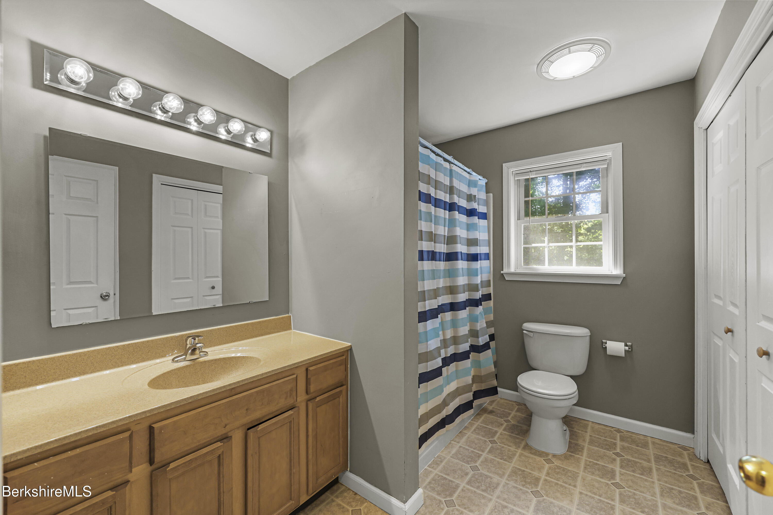 29 Balance Rock Road Lanesborough, MA 01237 - Photo 20 of 38 a bathroom with a sink a toilet and a mirror