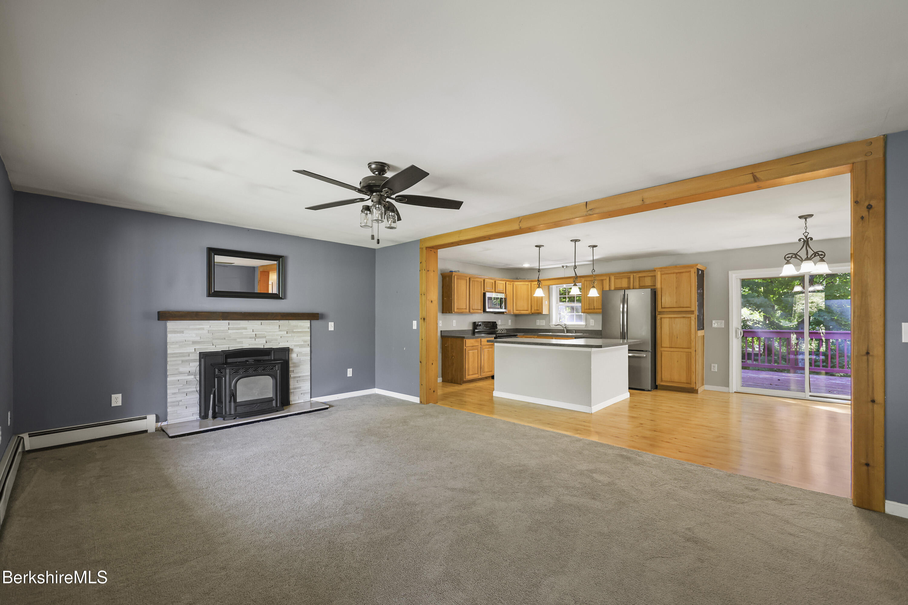 29 Balance Rock Road Lanesborough, MA 01237 - Photo 6 of 38 a view of an empty room with a fireplace