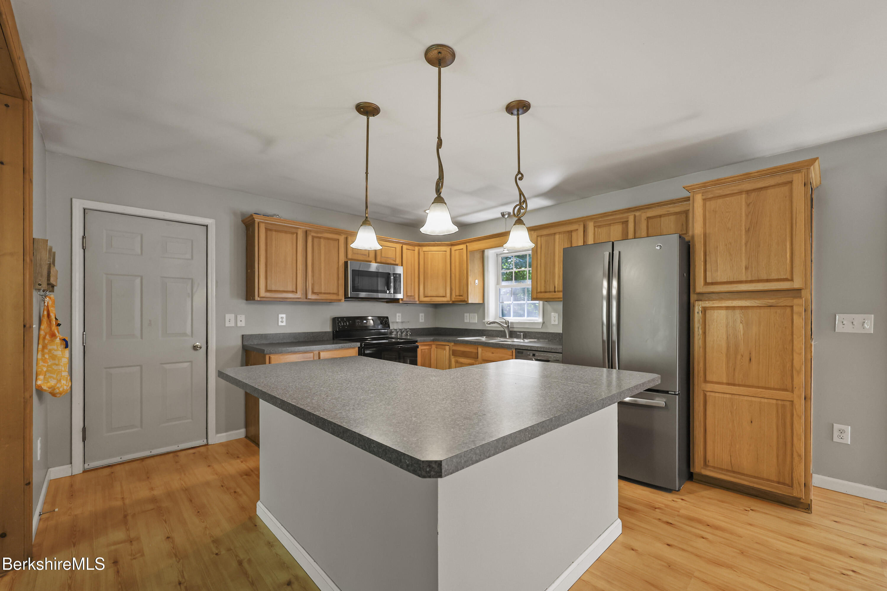 29 Balance Rock Road Lanesborough, MA 01237 - Photo 7 of 38 a kitchen with stainless steel appliances granite countertop a refrigerator a sink and a stove