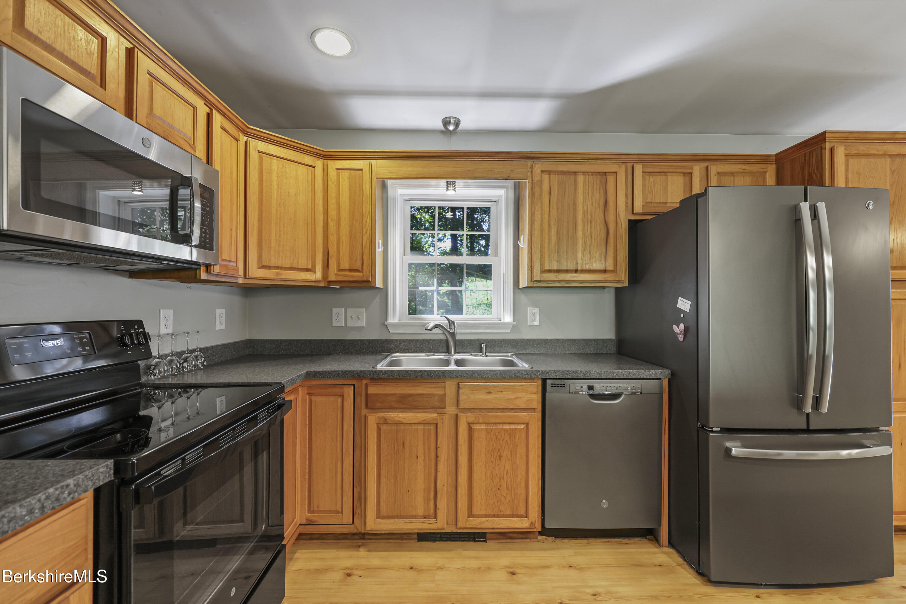 29 Balance Rock Road Lanesborough, MA 01237 - Photo 8 of 38 a kitchen with stainless steel appliances granite countertop a refrigerator stove top oven and sink