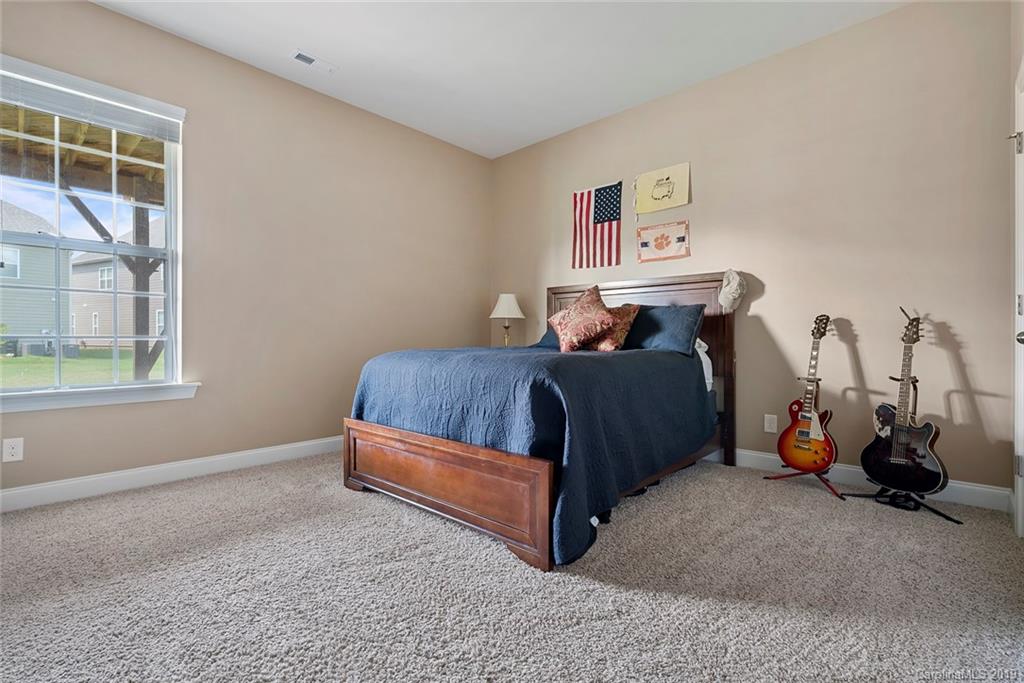 730 Falcon Ridge Fort Mill, SC 29708 - Photo 22 of 31 a bedroom with a bed and a window