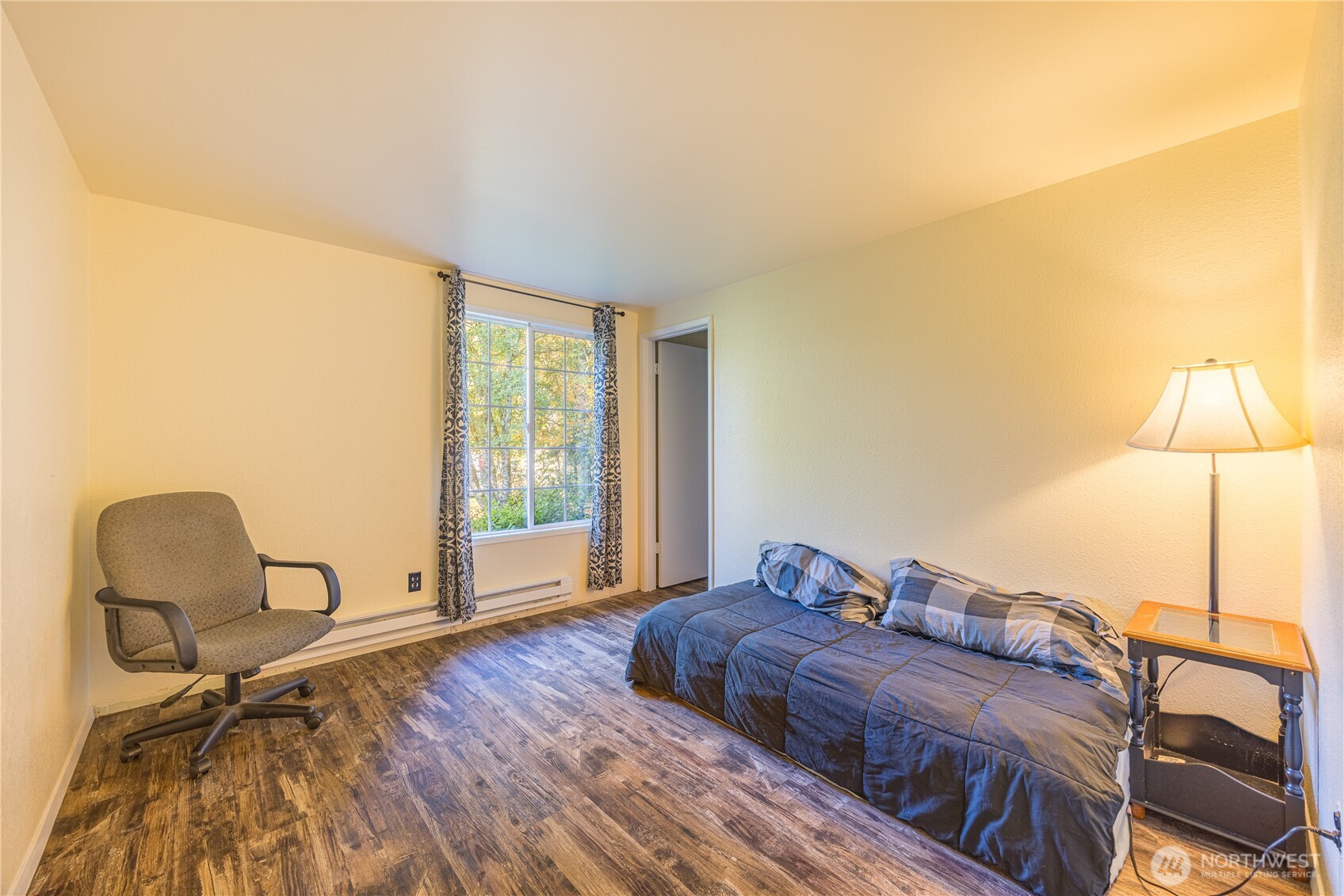 2095 Bear Creek Road Port Angeles, WA 98363 - Photo 16 of 39 a bedroom with a bed and a window