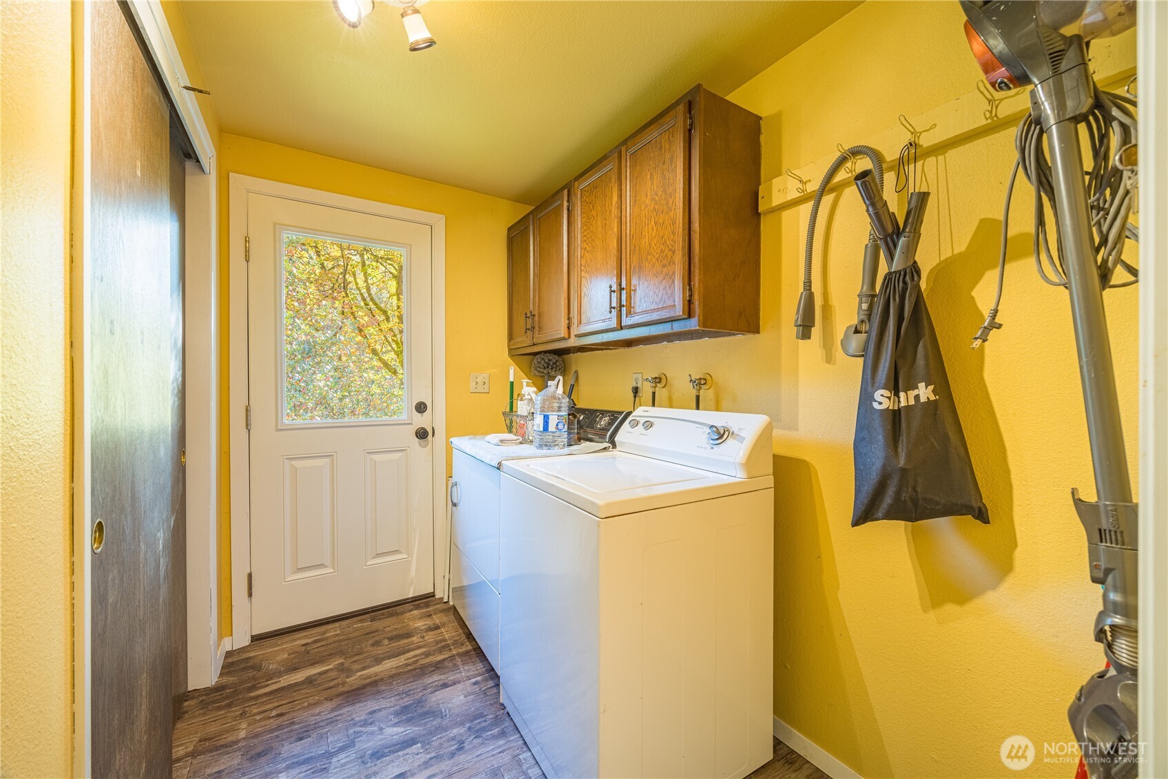 2095 Bear Creek Road Port Angeles, WA 98363 - Photo 18 of 39 a utility room with a sink and wooden floor