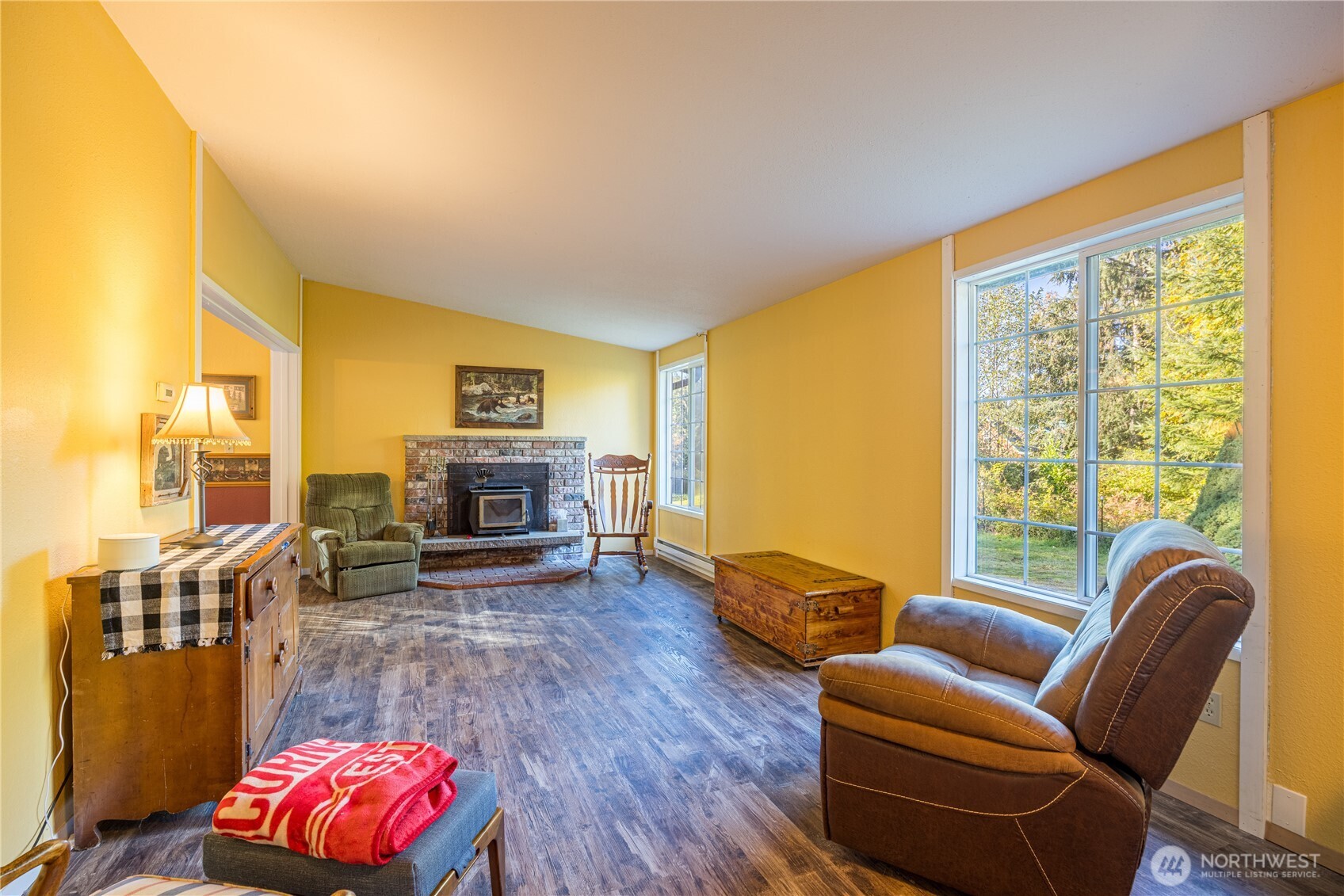 2095 Bear Creek Road Port Angeles, WA 98363 - Photo 2 of 39 a living room with furniture fireplace and a large window