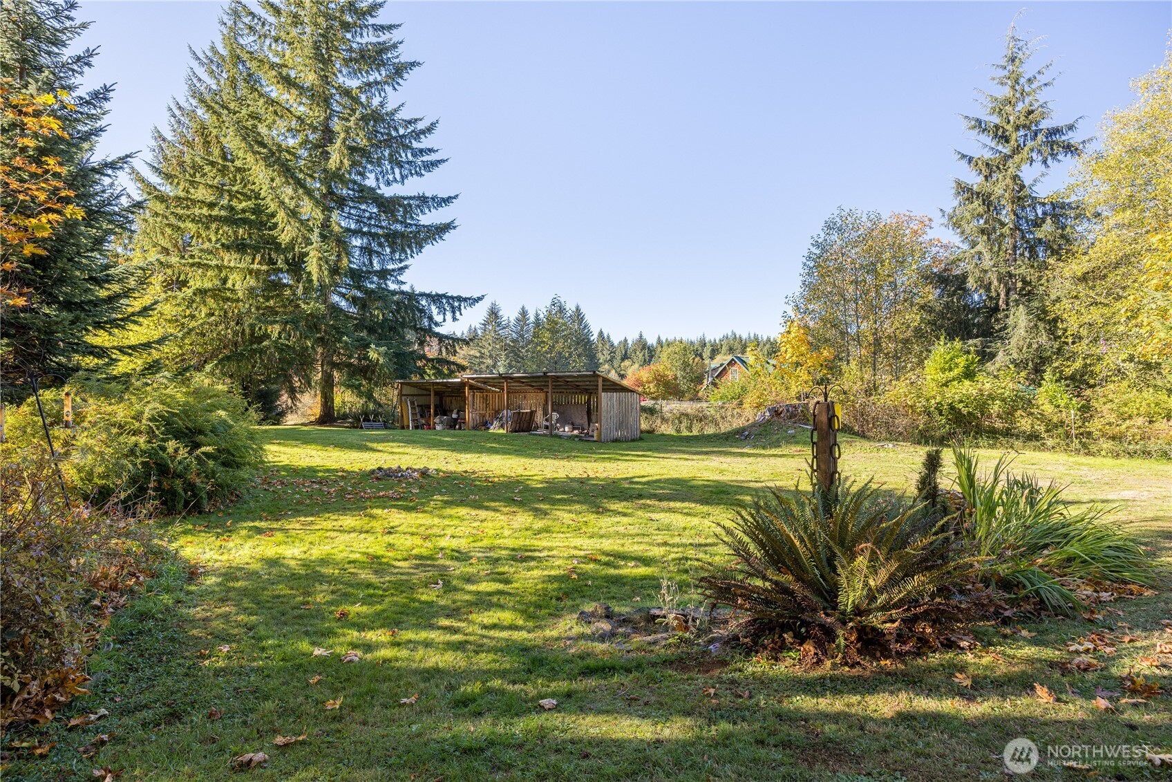 2095 Bear Creek Road Port Angeles, WA 98363 - Photo 21 of 39 a view of a swimming pool with an outdoor space and seating area