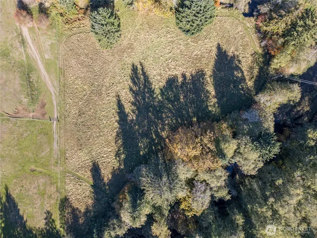 a view of a road with mountains in the background